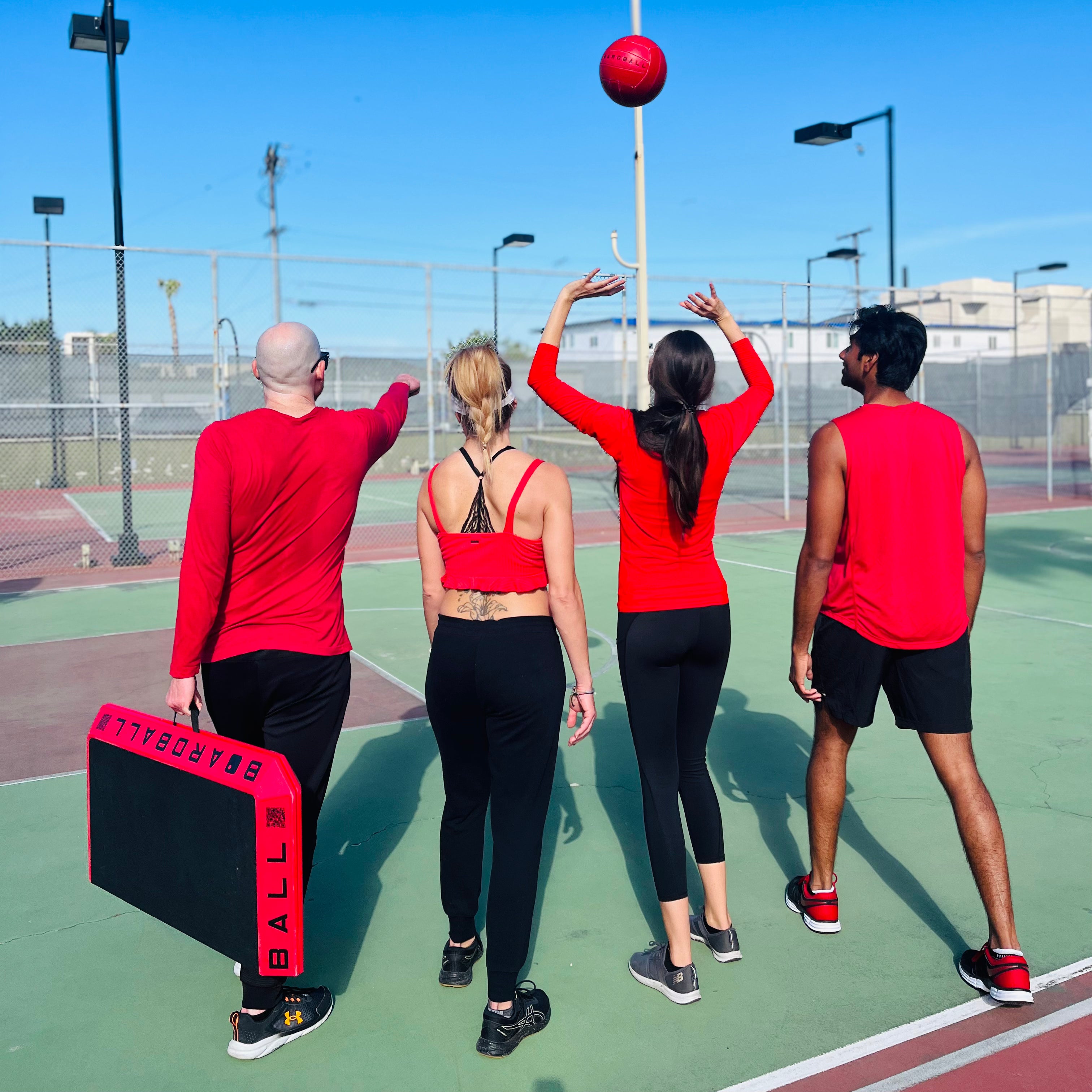 A group of athletes walking onto the court to play some boardball